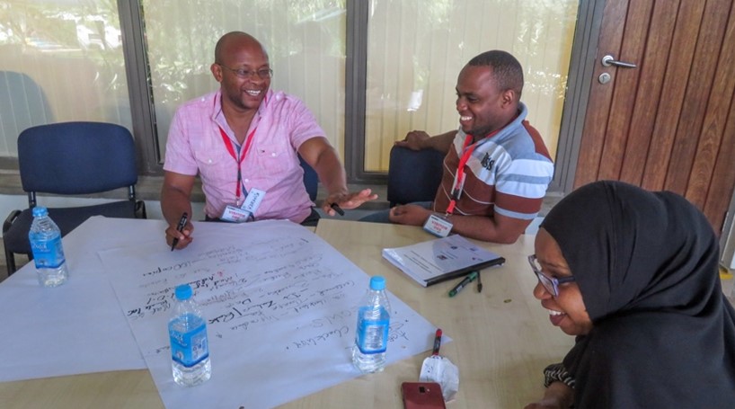 Participants working on facility action plans in Kilifi, Kenya