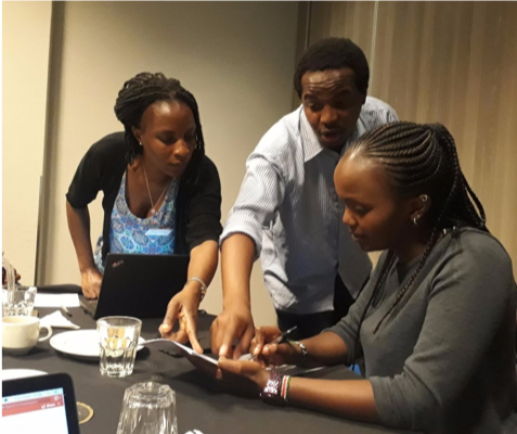 PhD students Irene Ayakaka Martin Njoroge and Wanjiku Kagima discuss maternal malnutrition effects on the lung health of babies