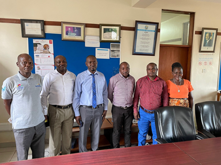 Health facility managers from the NIHR-funded MOCCA study in Uganda (L-R John Omong, from Kisugu HC III; Robert Nkalaba, from TASO Mulago; Dr. Kisuze Geoffrey, from Ndejje HC IV; Tibatta Eddy, from Kiswa HCIII; Lukwago Issa Kiggundu from Wakiso HCIV; Achan Oyella Paska, from Kiswa HCIII)