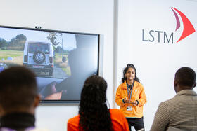 Photos of a student presenting at an LSTM Open Day