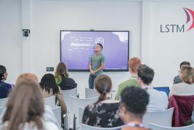 Photo of a student ambassador as an LSTM open event