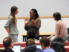 Dr Angela Obasi talking to LSTM students