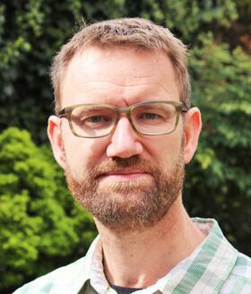 A headshot image of Professor Julian Eaton