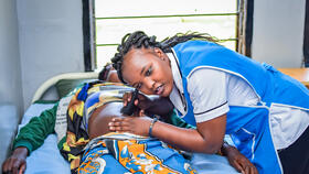 A dedicated nurse conducts a prenatal check-up using a fetal Doppler during an antenatal care (ANC) visit at Vihiga county hospital in Kenya - ensuring both mother's and baby’s well-being / copyright LSTM
