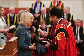 Her Majesty The Queen presents Professor David Lalloo with a Queen's Anniversary Prize