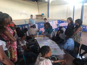 College of Medical and Allied Health Sciences (CoMAHS) team facilitating participatory discussion on non-communicable diseases with residents in Dwarzak informal settlement, Freetown, Sierra Leone. Image copyright: Haja Wurie, College of Medical and Allied Health Sciences (CoMAHS), Sierra Leone.