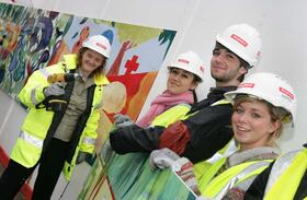 Director, Janet Hemingway helping the students install their artwork