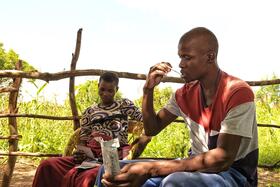 Man using HIV self-testing kit in Zimbabwe - photo credit: UNITAID