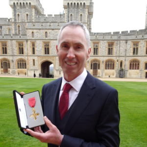 Andrew Furber at Winsor Castle with OBE award