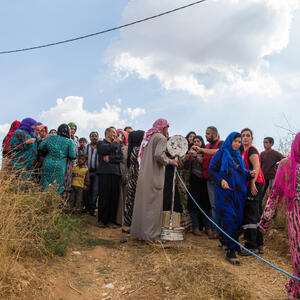 Refugees waiting to receive aid packages from humanitarian aid organisations in the Beqaa region Lebanon.
