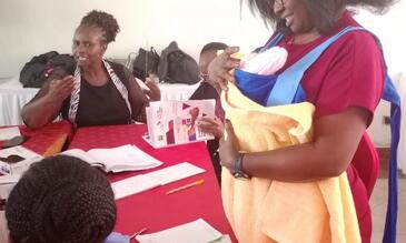 A participant during a return demonstration on Kangaroo Mother Care / photo LSTM