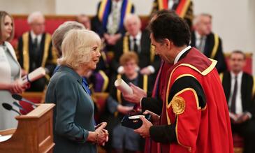 Her Majesty The Queen presents Professor David Lalloo with a Queen's Anniversary Prize