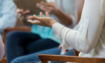 Image of a hand during a group therapy session