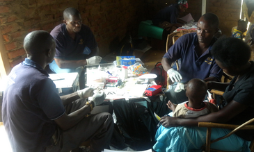 Blood samples being taken from a mother and child from Bukoba Village, Uganda
