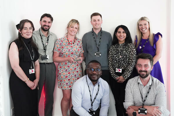 Photo of the Enterprise and Innovation team with their staff award