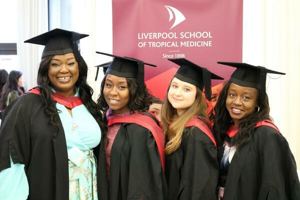 LSTM graduates in gowns and cap