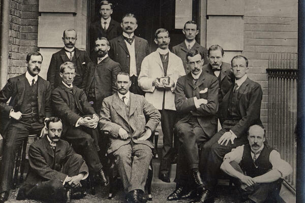 Early group photo of LSTM staff. Ronald Ross seated in the centre with Rubert Boyce seated far right.
