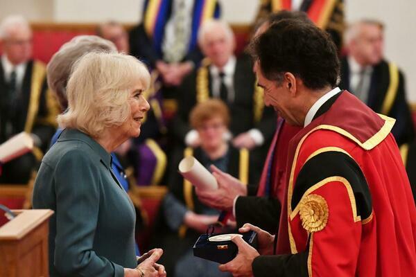 Her Majesty The Queen presents Professor David Lalloo with a Queen's Anniversary Prize