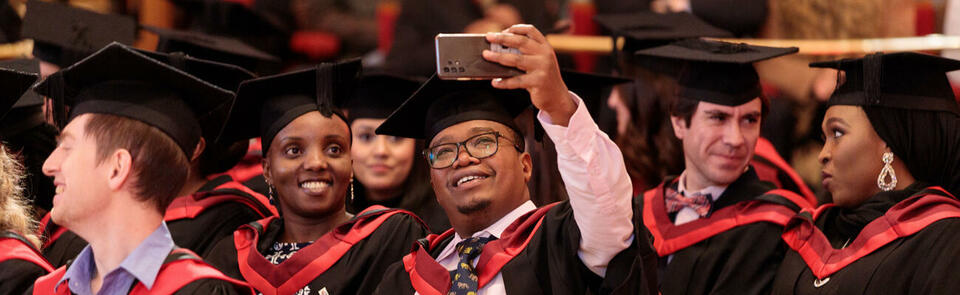 LSTM Students celebrating at the 2022 graduation in St. George's Hall