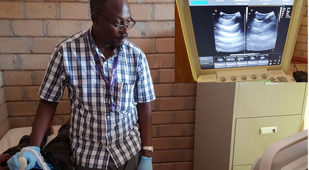 Dr Seke carrying out an ultrasonography relieving a small hydrocele