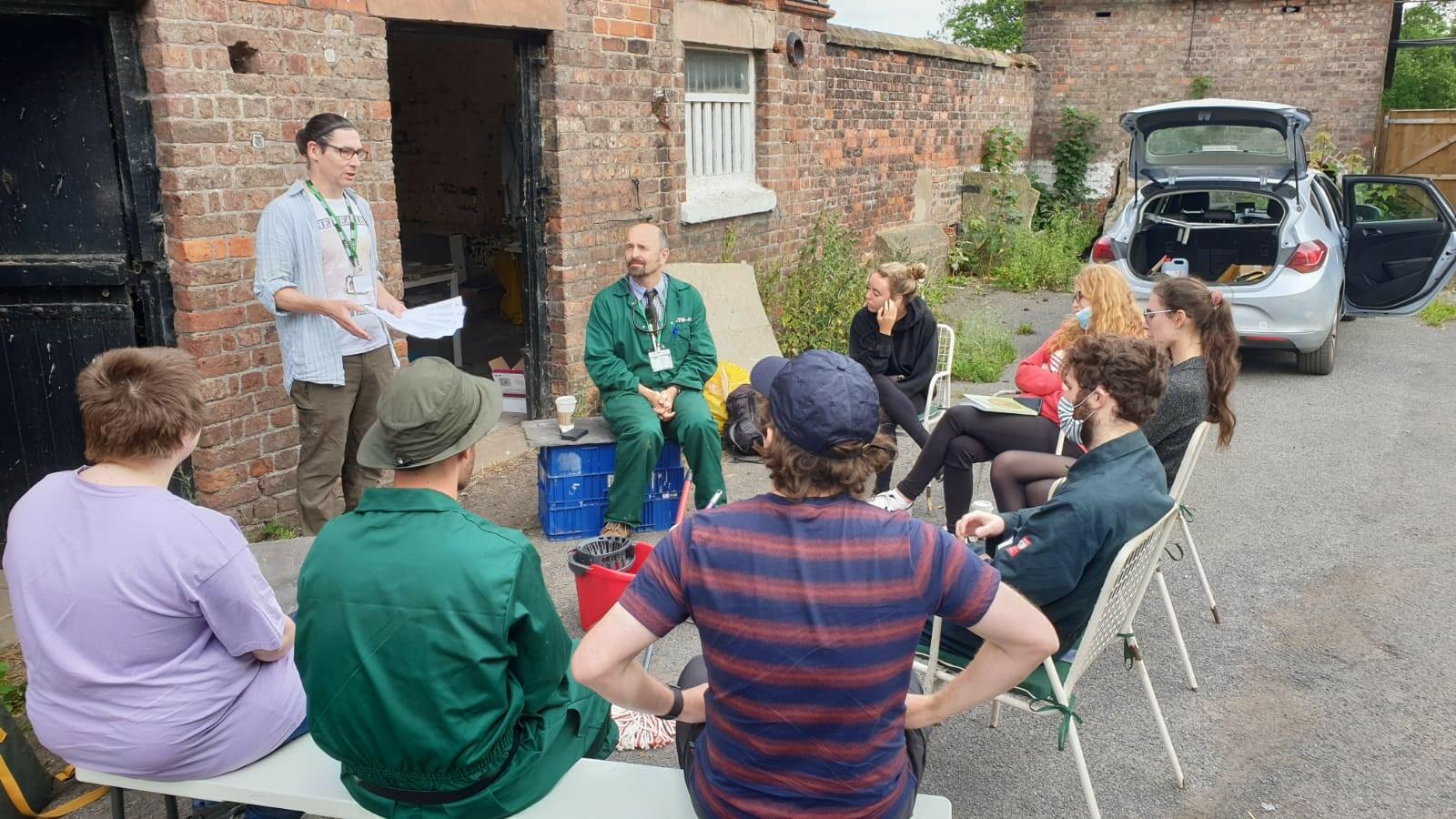 James LaCourse giving a Health and Safety brief outside of our assigned shed. 