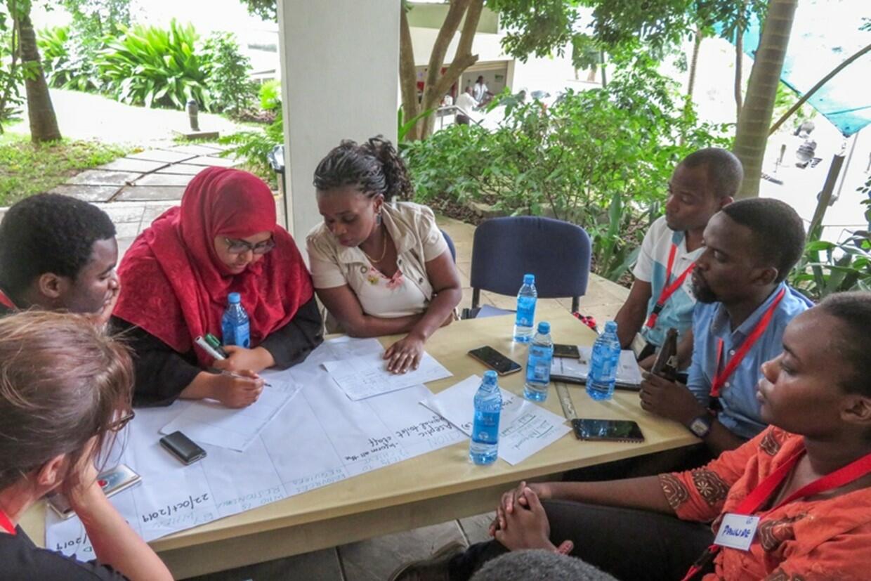 Participants working on facility action plans in Kilifi, Kenya