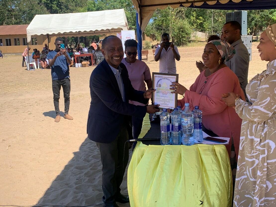 Prof. Mfinanga was receiving appreciation certificate from Hon. Zainabu Abdallah, Bagamoyo DC