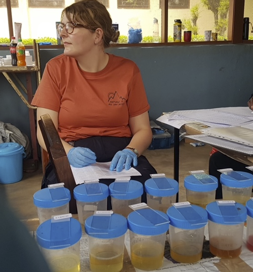 Ruth hard at work helping to process urine samples for microscopy
