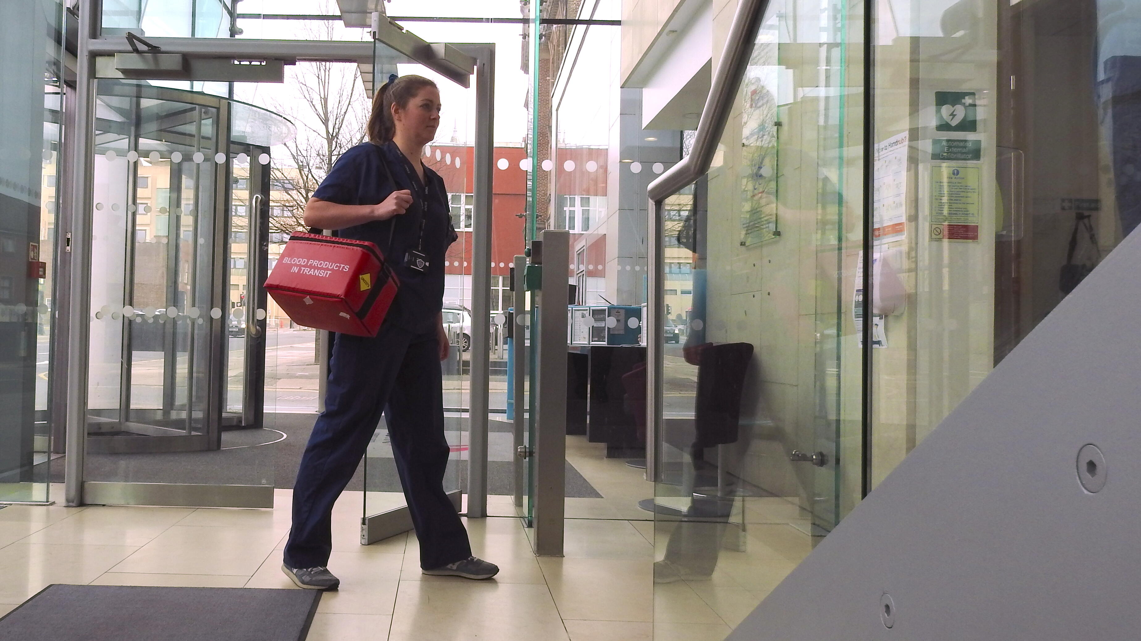 Research nurse arriving at CTID to transfer study samples to the laboratory