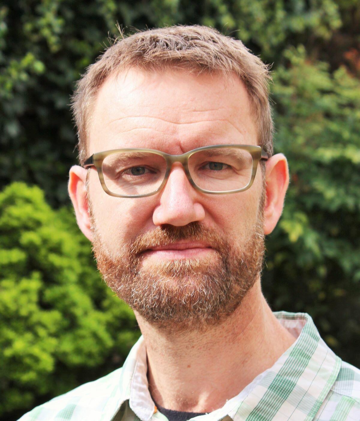 A headshot image of Professor Julian Eaton
