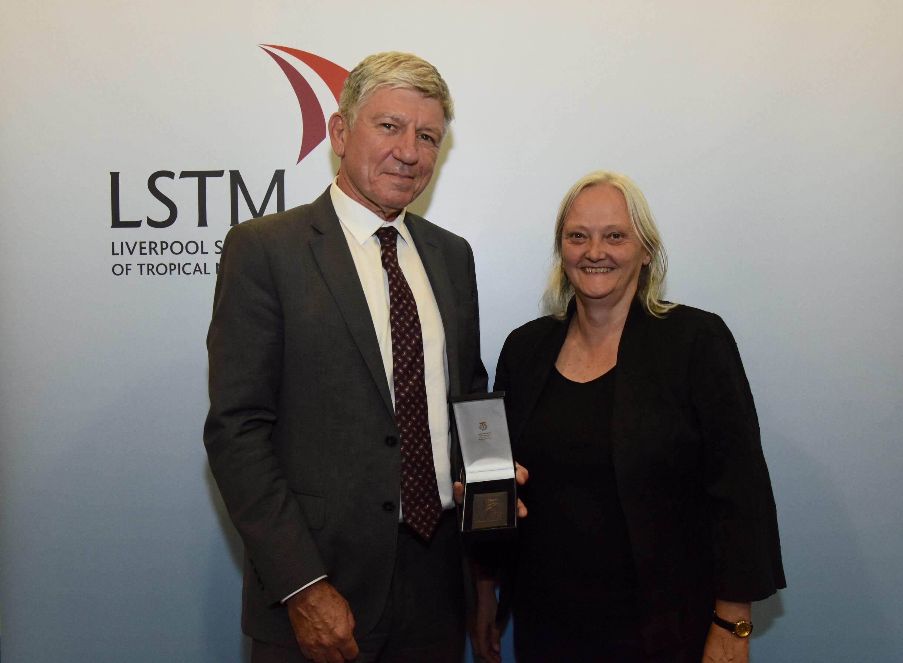 Professor Kevin Marsh receives the Kingsley medal from LSTM Director, Professor Janet Hemingway