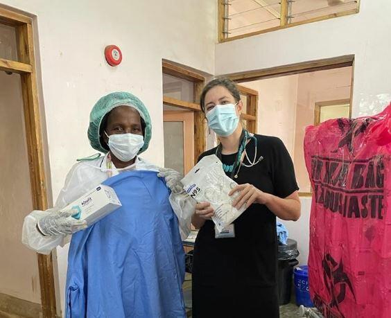 Sister Magombo (left), Lead Nurse and Dr Rachael Burke, PhD researcher and clinician, at Zomba Central Hospital receiving PPE purchased with Bump It Forward donations.