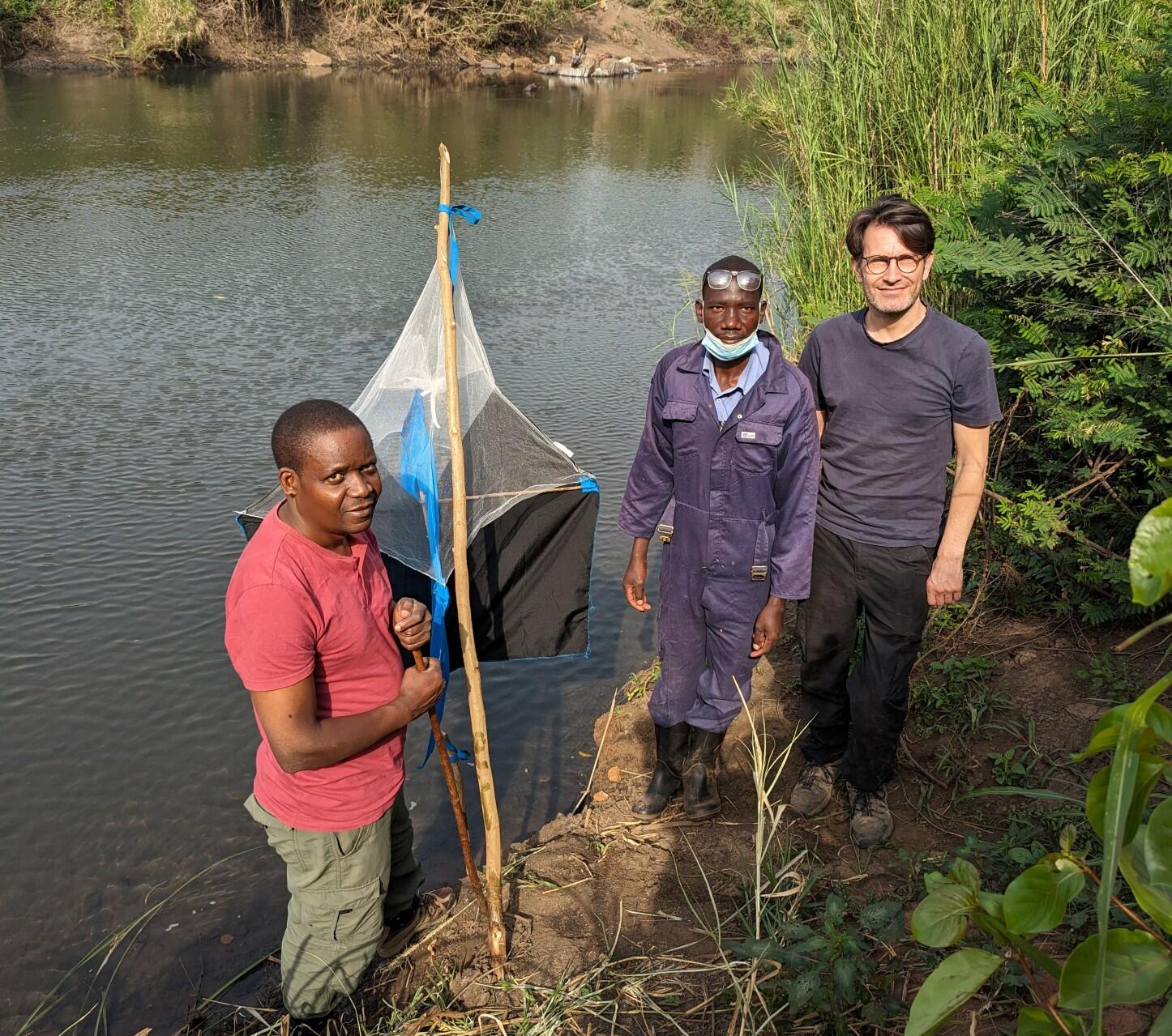 Dr Albert Mugenyi from Co-ordinating Office for Control of Trypanosomiasis in Uganda (COCTU), Benson Orach, Trap Attendant and Dr Andrew Hope from LSTM