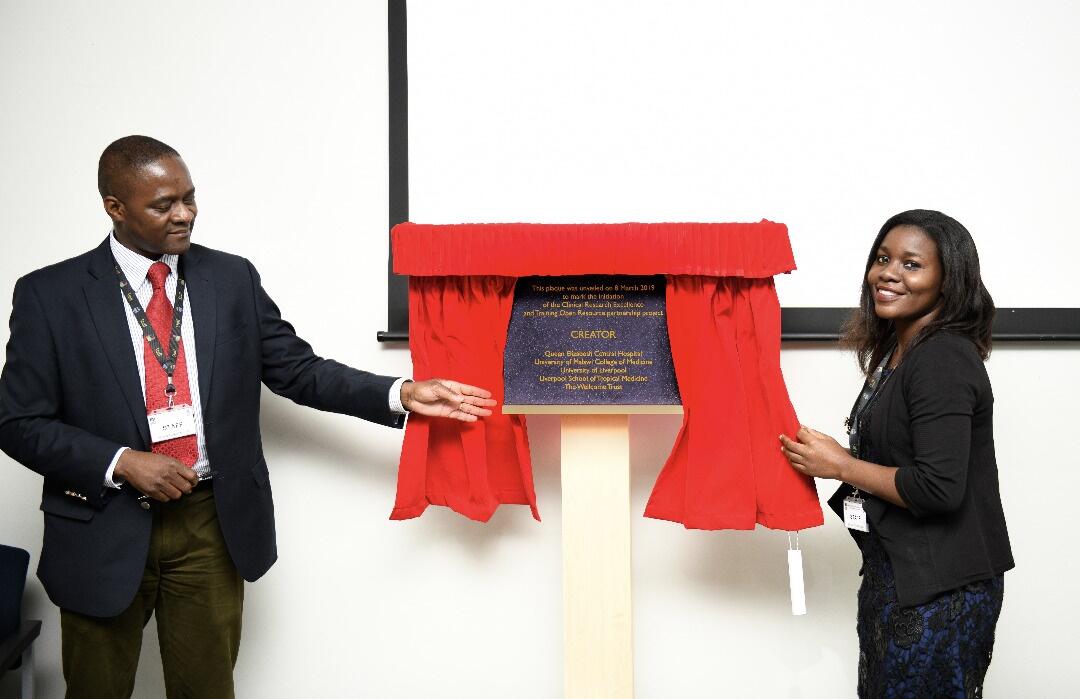 Dr Henry Mwandumba, deputy director of MLW, and Dr Fumbani Limani, clinical research intern of MLW unveiling a plaque to mark the occasion 