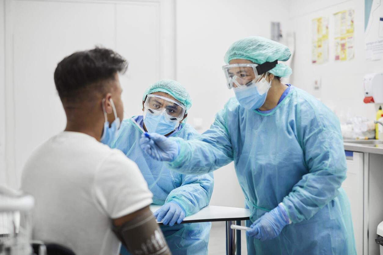 Female Doctor Taking Coronavirus Sample From Man