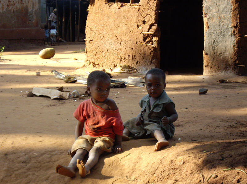 Two children sitting in the dust Two children sitting in the dust