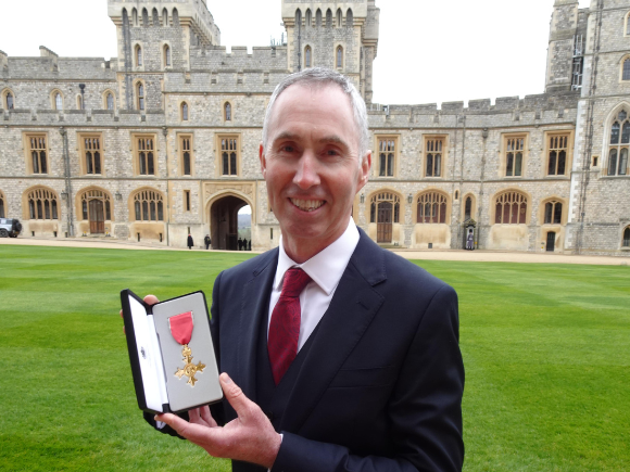 Andrew Furber at Winsor Castle with OBE award