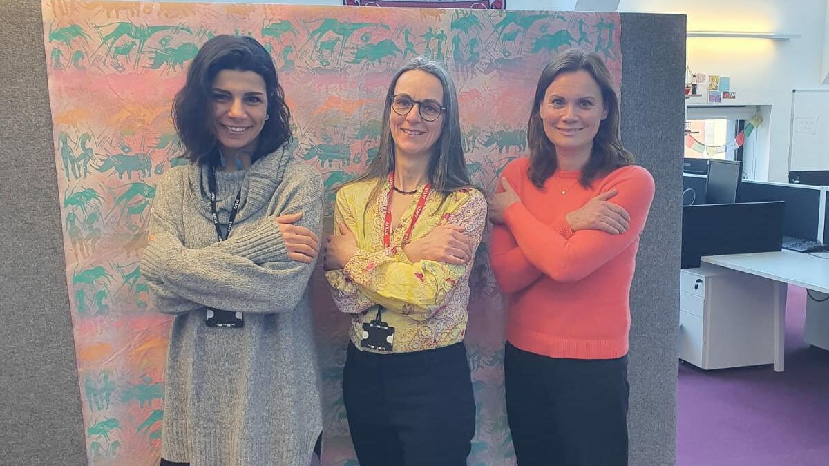 The LIGHT consortium's Knowledge Exchange Officer Taghreed El Hajj, Post-Doctoral Research Associate Beate Ringwald, and Research Uptake Manager Kerry Millington strike the #EmbraceEquity pose.