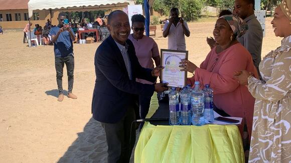 Prof. Mfinanga was receiving appreciation certificate from Hon. Zainabu Abdallah, Bagamoyo DC