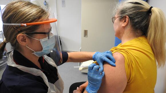 WTC staff member vaccinates a volunteer as part of the Oxford COVID-19 vaccine trial