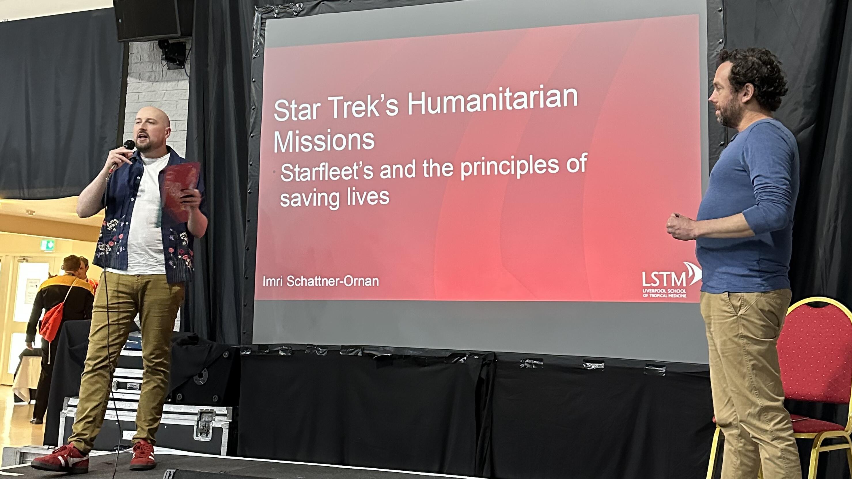 Photo of Imri (right) being introduced at the convention