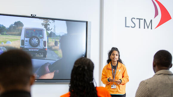 Photos of a student presenting at an LSTM Open Day