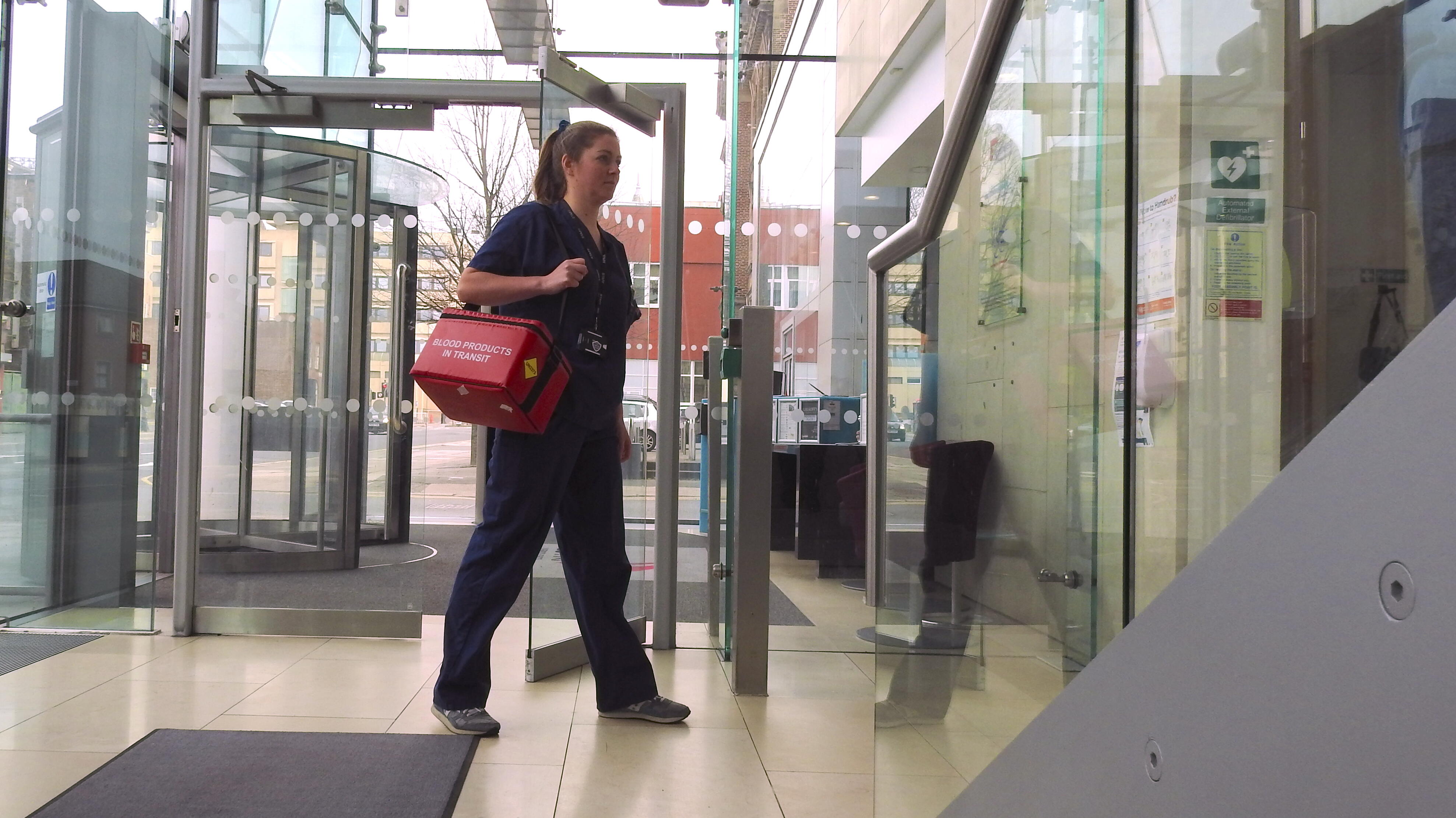 Research nurse arriving at CTID to transfer study samples to the laboratory