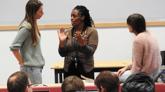 Dr Angela Obasi talking to LSTM students