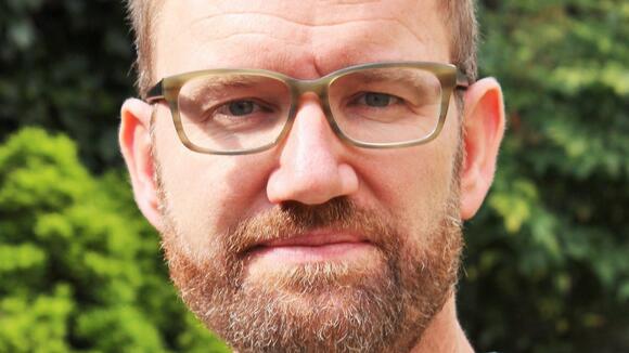 A headshot image of Professor Julian Eaton