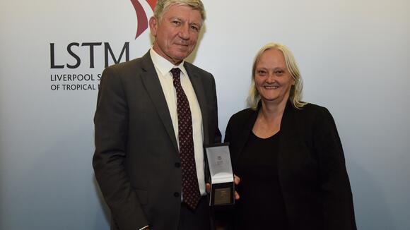 Professor Kevin Marsh receives the Kingsley medal from LSTM Director, Professor Janet Hemingway