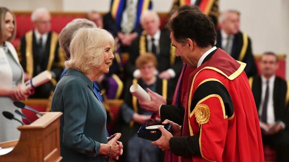 Her Majesty The Queen presents Professor David Lalloo with a Queen's Anniversary Prize