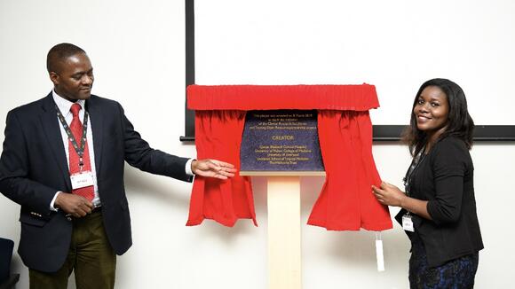 Dr Henry Mwandumba, deputy director of MLW, and Dr Fumbani Limani, clinical research intern of MLW unveiling a plaque to mark the occasion 