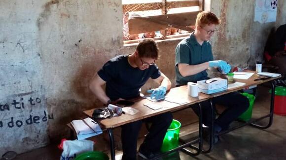 LSTM students, Angus More O'Ferrall and Hamish Baxter, doing their research in Malawi