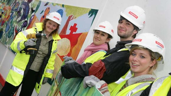 Director, Janet Hemingway helping the students install their artwork